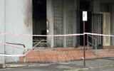 The fire-damaged Adass Israel Synagogue is cordoned off following an arson attack there, in Melbourne, Australia, December 6, 2024. (Tania Lee / AFP)