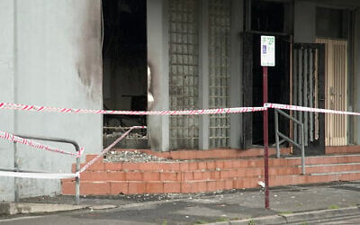 The fire-damaged Adass Israel Synagogue is cordoned off following an arson attack there, in Melbourne, Australia, December 6, 2024. (Tania Lee / AFP)