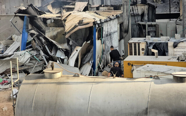 People check the damage outside the Kamal Adwan hospital in Beit Lahia in the northern Gaza Strip, following Israeli strikes around the medical complex on December 6, 2024. (AFP) People check the damage outside the Kamal Adwan hospital in Beit Lahia in the northern Gaza Strip, following Israeli strikes around the medical complex on December 6, 2024. (AFP)