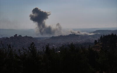 Smoke billows following an Israeli airstrike on the outskirts of Damascus on December 8, 2024, after Islamist-led rebels declared that they have taken the Syrian capital in a lightning offensive, sending President Bashar al-Assad fleeing and ending five decades of Baath rule in Syria. (Omar Haj Kadour/AFP)