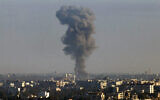 Illustrative: This picture taken from the Israeli Golan Heights shows smoke billowing above the Syrian Governorate of Quneitra after an Israeli strike, on December 9, 2024. (Jalaa Marey/AFP)