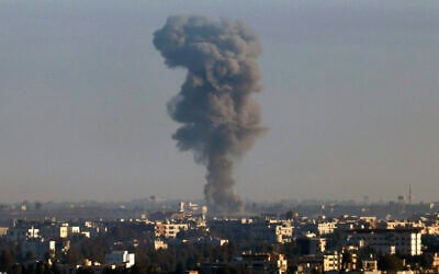Illustrative: This picture taken from the Israeli Golan Heights shows smoke billowing above the Syrian Governorate of Quneitra after an Israeli strike, on December 9, 2024. (Jalaa Marey/AFP)