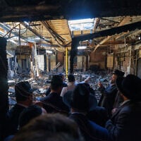 Australia's Prime Minister Anthony Albanese (C) and members of the local Jewish community visiting the torched Adass Israel Synagogue in Melbourne on December 10, 2024. (DEPARTMENT OF PRIME MINISTER AND CABINET / AFP)