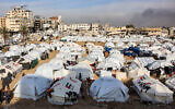 A tent camp sheltering Palestinians displaced from north of Gaza City in an empty plot of government-owned land in the city center on December 11, 2024. (Omar Al-Qattaa / AFP)