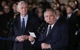 France's newly appointed Prime Minister Francois Bayrou (R), flanked by outgoing Prime Minister Michel Barnier, during the handover ceremony at the Hotel Matignon in Paris, France on December 13, 2024. (Thomas Samson/AFP)