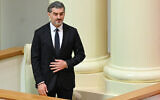 Mikheil Kavelashvili reacts after being elected as Georgian's new president at the parliament in Tbilisi on December 14, 2024. (Vano Shlamov/AFP)