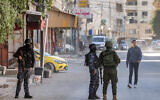 Palestinian security forces deploy to Jenin in the north of the West Bank on December 17, 2024. (Photo by Jaafar Ashtiyeh/AFP)
