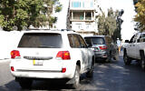 Cars belonging to the US delegation drive in a street in Damascus, Syria, on December 20, 2024. (Omar Haj Kadour/AFP)