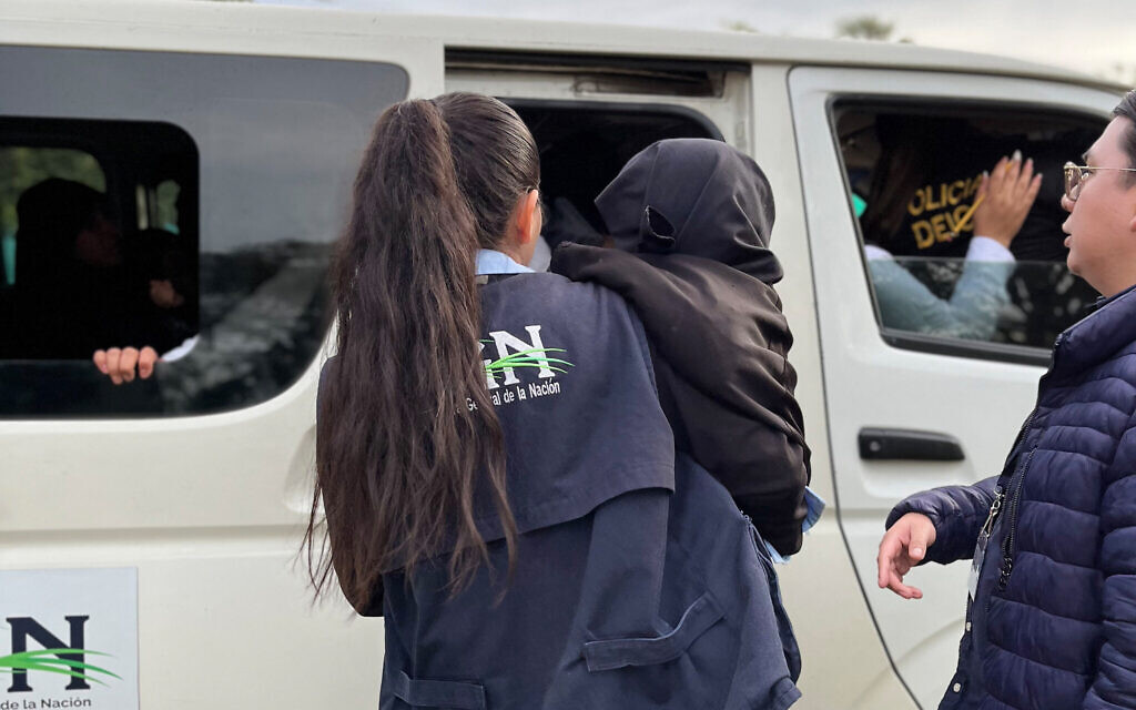 This handout picture released by the Guatemalan Attorney General of the Nation's Office (PGN) shows members of the PGN taking part in a child rescue operation at a Lev Tahor farm in the municipality of Oratorio, Guatemala, on December 20, 2024 (Handout / Guatemalan Attorney General of the Nation's Office / AFP)