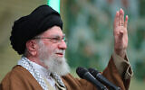 This handout picture released by the office of Iran's Supreme Leader Ayatollah Ali Khamenei on December 22, 2024, shows him greeting visitors as he makes a speech in Tehran. (KHAMENEI.IR / AFP)