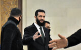 Syria's new leader Ahmed al-Sharaa (C) arrives for a meeing with visiting Druze officials from Lebanon's Progressive Socialist Party (PSP) in Damascus on December 22, 2024. (Photo by AFP)