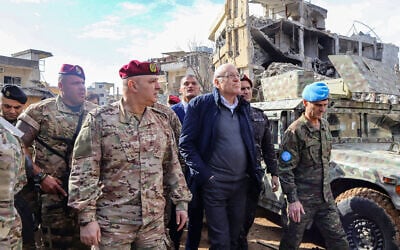 Lebanon's caretaker Prime Minister Najib Mikati (2nd from right), Lebanese army commander -- and now President -- General Joseph Aoun (to Mikati's left), and Major General Aroldo Lazaro, Head of Mission and Force Commander of the United Nations Interim Force in Lebanon (UNIFIL) (R) visit the southern Lebanese village of Khiam on December 23, 2024, after the withdrawal of Israeli forces from the area under a ceasefire deal with Hezbollah. (AFP)