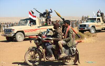 Yemeni rebels demonstrate in the suburbs of the Houthi-controlled capital Sana'a, on December 23, 2024. (Photo by Mohammed HUWAIS / AFP)