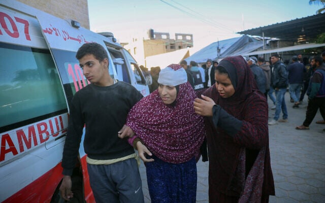 Illustrative. A Palestinian woman is helped out of an ambulance after she was wounded amid fighting in Gaza, on December 24, 2024, in Deir el-Balah in the central Gaza Strip. (Eyad BABA / AFP) Illustrative. A Palestinian woman is helped out of an ambulance after she was wounded amid fighting in Gaza, on December 24, 2024, in Deir el-Balah in the central Gaza Strip. (Eyad BABA / AFP)