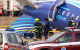 Emergency specialists work at the crash site of an Azerbaijan Airlines passenger jet near the western Kazakh city of Aktau on December 25, 2024. (Photo by Issa Tazhenbayev / AFP)