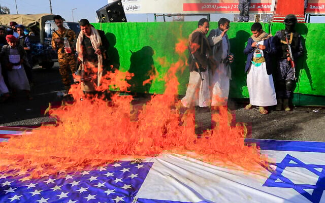 Yemenis set fire to US and Israeli flags during a demonstration in the Houthi-controlled capital Sanaa on December 27, 2024. (Mohammed Huwais/AFP) Yemenis set fire to US and Israeli flags during a demonstration in the Houthi-controlled capital Sanaa on December 27, 2024. (Mohammed Huwais/AFP)