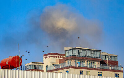 A smoke cloud billows after an airstrike on Yemen's Houthi-held capital Sanaa on December 31, 2024. (Mohammed Huwais/AFP)