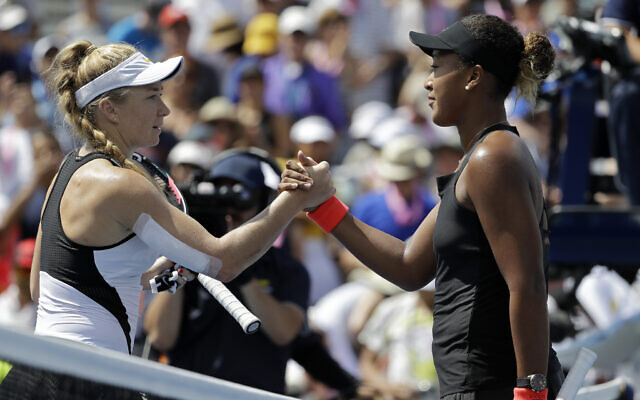 Naomi Osaka, right, of Japan, shakes hands with Julia Glushko, of Israel, after Osaka defeated Glushko during the second round of the US Open tennis tournament, Aug. 30, 2018, in New York. (AP Photo/Seth Wenig) Naomi Osaka, right, of Japan, shakes hands with Julia Glushko, of Israel, after Osaka defeated Glushko during the second round of the US Open tennis tournament, Aug. 30, 2018, in New York. (AP Photo/Seth Wenig)