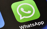 A WhatsApp icon is displayed on an iPhone. (AP Photo/Martin Meissner, File)