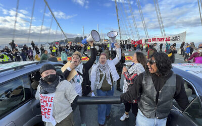 Demonstrators shut down the San Francisco Oakland Bay Bridge in conjunction with the APEC Summit taking place Thursday, Nov. 16, 2023, in San Francisco. (AP Photo/Noah Berger, File)