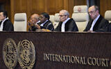Presiding Judge Nawaf Salam reads a non-binding advisory opinion regarding Israel and disputed territories, in the International Court of Justice in The Hague, Netherlands, July 19, 2024. (AP Photo/Phil Nijhuis)