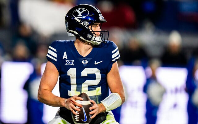 BYU quarterback Jake Retzlaff looks downfield during the first half of an NCAA college football game against Houston November 30, 2024, in Provo. (AP Photo/Rick Egan)