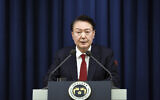 In this photo provided by South Korea Presidential Office, South Korean President Yoon Suk Yeol speaks during a press briefing at the presidential office in Seoul, South Korea, Dec. 3, 2024. (South Korea Unification Ministry via AP).