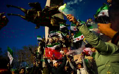 People gather to celebrate the Syrian government fall in Istanbul, Turkey, Sunday, December 8, 2024. (AP Photo/Emrah Gurel)