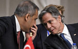 Turkey's Foreign Minister Hakan Fidan, left, speaks with US Secretary of State Antony Blinken during a meeting with the foreign ministers of the Arab Contact Group on Syria in Jordan's southern Red Sea coastal city of Aqaba, December 14, 2024. (Andrew Caballero-Reynolds/Pool via AP)