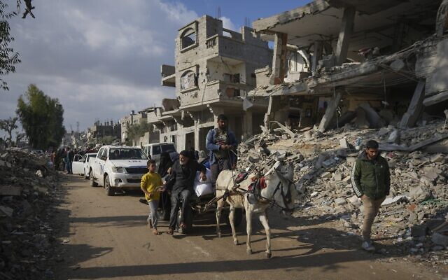 Palestinians in Khan Younis, central Gaza Strip, December 14, 2024. (AP Photo/Abdel Kareem Hana)