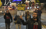 Protesters outside the IDF's Kirya military headquarters in Tel Aviv call for the release of the hostages on December 17, 2024. (AP/Ariel Schalit)