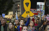 People protest against Prime Minister Benjamin Netanyahu's government and call for the release of hostages, held in the Gaza Strip by the Hamas terror group, in Tel Aviv, Israel, December 21, 2024. (AP Photo/Ohad Zwigenberg)