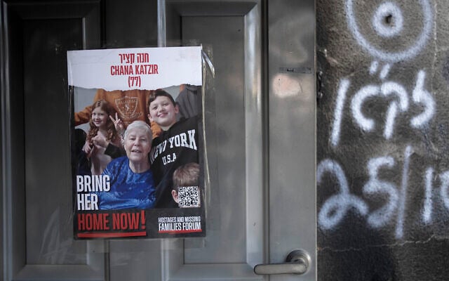 A poster calling for the release of Hanna Katzir is taped to the door of her home in Kibbutz Nir Oz on November 21, 2023. (AP /Maya Alleruzzo) A poster calling for the release of Hanna Katzir is taped to the door of her home in Kibbutz Nir Oz on November 21, 2023. (AP /Maya Alleruzzo)