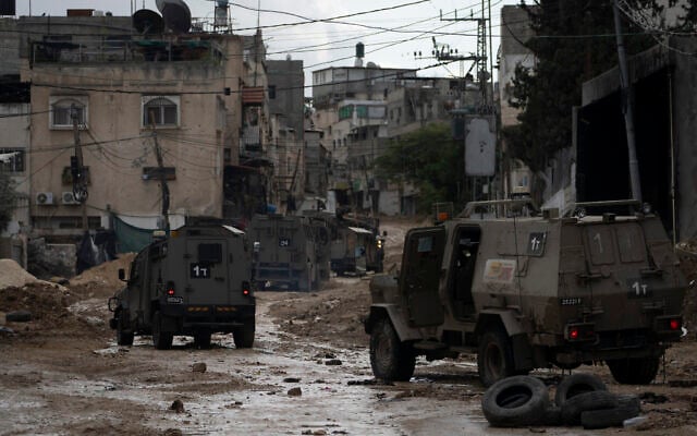 A convoy of Israeli military armored vehicles is seen during a raid in the Tulkarem refugee camp near the West Bank city of Tulkarem, Dec. 24, 2024. (AP/Majdi Mohammed) A convoy of Israeli military armored vehicles is seen during a raid in the Tulkarem refugee camp near the West Bank city of Tulkarem, Dec. 24, 2024. (AP/Majdi Mohammed)