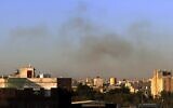 Smoke rises from the area around Sanaa International Airport following an Israeli airstrike, as seen from Sanaa, Yemen, Dec. 26, 2024. (AP/Osamah Abdulrahman)