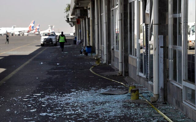 Workers walk past broken glass in Sanaa International Airport following Israeli airstrikes on Yemen the previous day, December 27, 2024. (AP Photo/Osamah Abdulrahman) Workers walk past broken glass in Sanaa International Airport following Israeli airstrikes on Yemen the previous day, December 27, 2024. (AP Photo/Osamah Abdulrahman)
