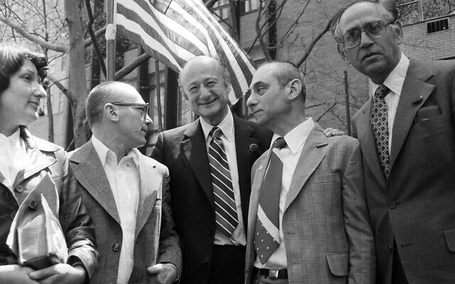 New York Mayor Edward Koch, center, talks with Soviet dissidents Mark Dymshits, right, Eduard Kuznetsov, and Kuznetsov's wife Sylvia at Dag Hammarskjöld Plaza in New York, April 29, 1979 (AP Photo/David Karp)