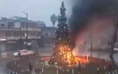 Screen capture from video of a Christmas tree that was set alight in the Christian-majority town of Suqaylabiyah, near Hama, Syria, December 24, 2024. (X. Used in accordance with Clause 27a of the Copyright Law)