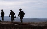 IDF soldiers are seen at a former Syrian Army post at Tel Kwdana, Syria, December 11, 2024. (Emanuel Fabian/Times of Israel)