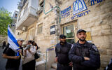 Illustrative: Anti-government protesters and police stand next to the Jerusalem Rabbinate and Religious Council, May 4, 2023. (Yonatan Sindel/Flash90)