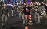 Police detain a protester demonstrating in favor of a hostage deal with Hamas outside the Defense Ministry in Tel Aviv, September 7, 2024. (Gili Yaari /FLASH90)
