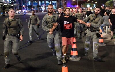 Police detain a protester demonstrating in favor of a hostage deal with Hamas outside the Defense Ministry in Tel Aviv, September 7, 2024. (Gili Yaari /FLASH90)