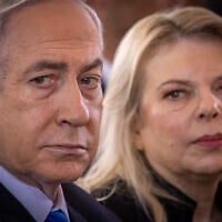 Prime Minister Benjamin Netanyahu, left, and his wife Sara at a state ceremony marking the Hebrew calendar anniversary of the Hamas attack on October 7, 2023, at Mount Herzl military cemetery in Jerusalem on October 27, 2024. (Chaim Goldberg/FLASH90)