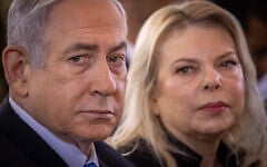 Prime Minister Benjamin Netanyahu, left, and his wife Sara at a state ceremony marking the Hebrew calendar anniversary of the Hamas attack on October 7, 2023, at Mount Herzl military cemetery in Jerusalem on October 27, 2024. (Chaim Goldberg/FLASH90)