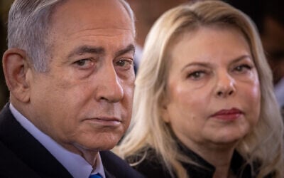 Prime Minister Benjamin Netanyahu, left, and his wife Sara at a state ceremony marking the Hebrew calendar anniversary of the Hamas attack on October 7, 2023, at Mount Herzl military cemetery in Jerusalem on October 27, 2024. (Chaim Goldberg/FLASH90) Prime Minister Benjamin Netanyahu, left, and his wife Sara at a state ceremony marking the Hebrew calendar anniversary of the Hamas attack on October 7, 2023, at Mount Herzl military cemetery in Jerusalem on October 27, 2024. (Chaim Goldberg/FLASH90)
