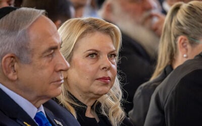 Sara Netanyahu, center, and her husband Prime Minister Benjamin Netanyahu attend a state ceremony marking the first Hebrew calendar anniversary of the October 7, 2023, Hamas onslaught, at the Mount Herzl military cemetery in Jerusalem, October 27, 2024. (Chaim Goldberg FLASH90)