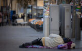 A homeless person in the streets of Jerusalem. December 18, 2024. (Chaim Goldberg/ FLASH90)