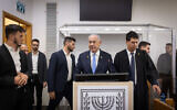 Prime Minister Benjamin Netanyahu arrives to the courtroom at the District court in Tel Aviv, before the start of his testimony in the trial against him, December 18, 2024. (Miriam Alster/Flash90)