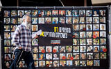 A poster showing hostages held in the Gaza Strip, displayed at Hostages Square in Tel Aviv, December 22, 2024. (Miriam Alster/FLASH90)