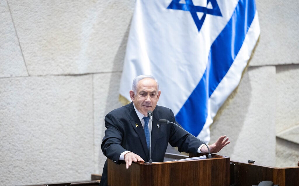 Prime Minister Benjamin Netanyahu addresses the Knesset in Jerusalem on December 23, 2024. (Chaim Goldberg/Flash90)